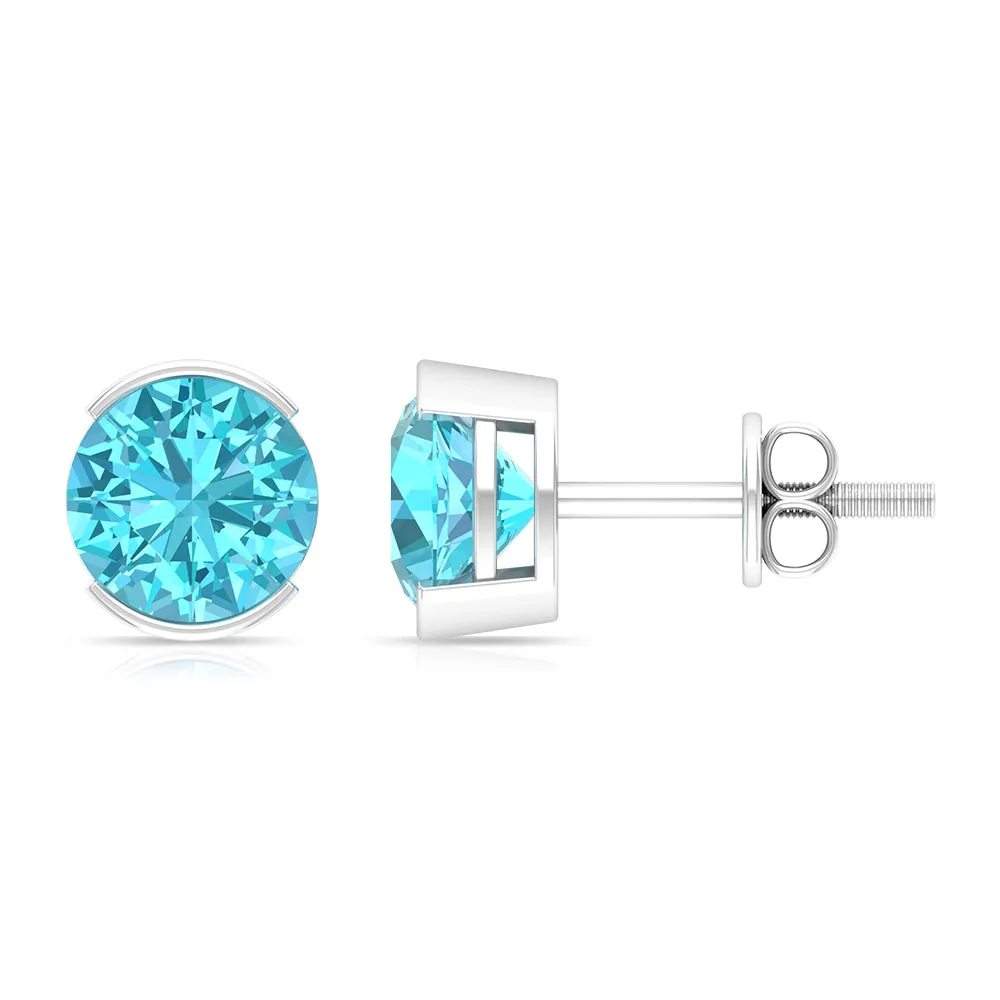 Swiss Blue Topaz Solitaire Stud Earrings in Half Bezel Setting